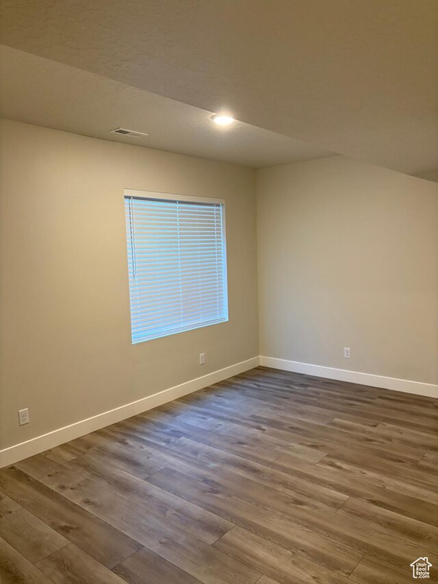 964 W Shadow Brook Ln, Lehi, UT 84043 - empty room with dark wood-style flooring, baseboards, and recessed lighting