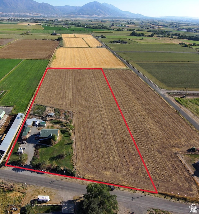 1777 W Palmyra Dr, Palmyra, UT 84660 - aerial view of sparsely populated area featuring farmland, property parcel outlined, and a mountainous background