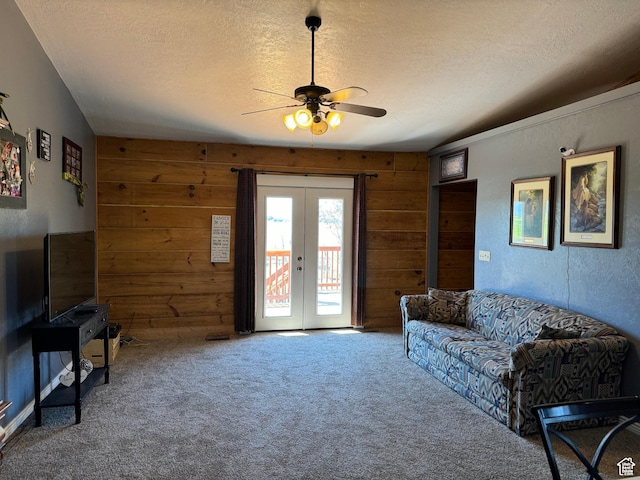 1777 W Palmyra Dr, Palmyra, UT 84660 - living room with french doors, wooden walls, ceiling fan, a textured ceiling, and carpet floors