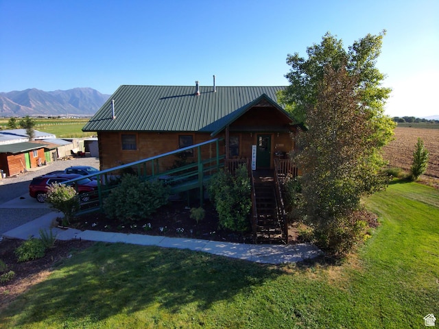 1777 W Palmyra Dr, Palmyra, UT 84660 - view of front of property featuring a front lawn, stairs, metal roof, and a mountain view