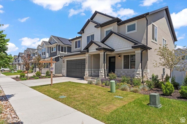 12361 S Xander Ln, Herriman, UT 84096 - craftsman-style house featuring stone siding, concrete driveway, a residential view, and a front yard