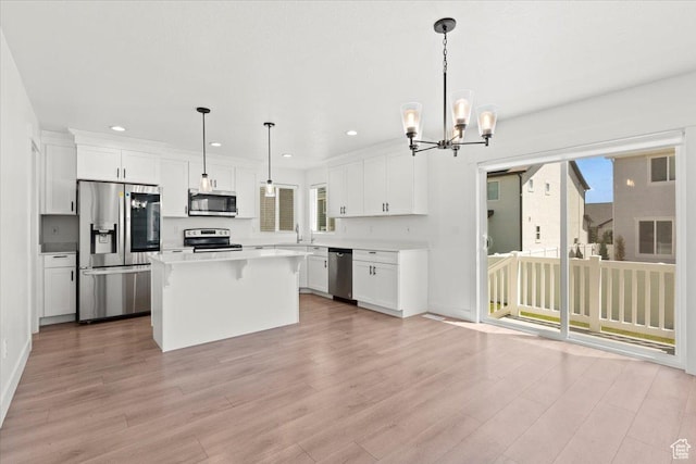 12361 S Xander Ln, Herriman, UT 84096 - kitchen featuring appliances with stainless steel finishes, recessed lighting, white cabinetry, light countertops, and light wood-type flooring