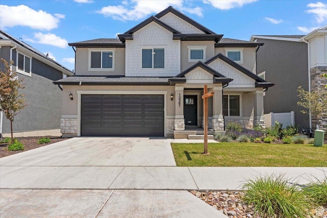 12361 S Xander Ln, Herriman, UT 84096 - craftsman-style home with stone siding, concrete driveway, an attached garage, and a front lawn