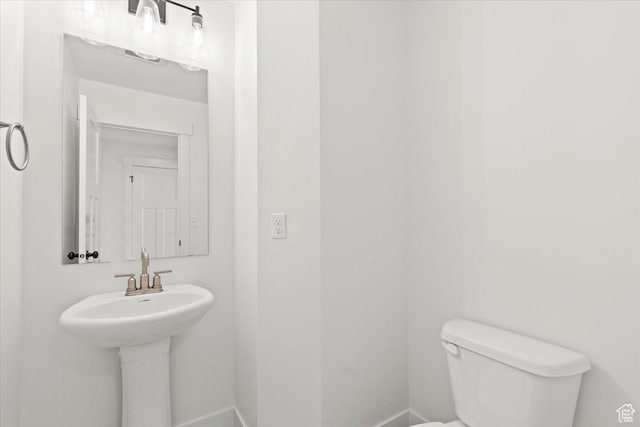 12361 S Xander Ln, Herriman, UT 84096 - half bathroom featuring toilet and baseboards