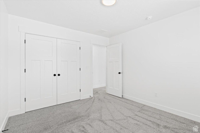12361 S Xander Ln, Herriman, UT 84096 - unfurnished bedroom featuring carpet, baseboards, and a closet
