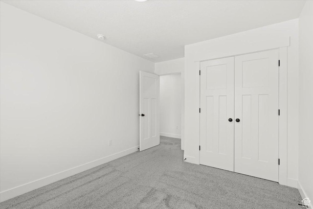 12361 S Xander Ln, Herriman, UT 84096 - unfurnished bedroom with carpet flooring, baseboards, and a closet