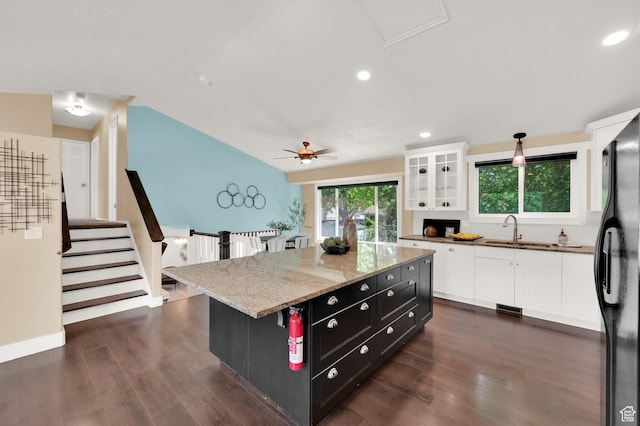 524 E 1200 S, Kaysville, UT 84037 - kitchen featuring a sink, white cabinets, freestanding refrigerator, dark wood-style floors, and lofted ceiling