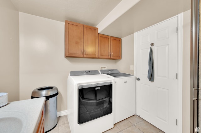 524 E 1200 S, Kaysville, UT 84037 - laundry room with cabinet space, washer and clothes dryer, and light tile patterned floors