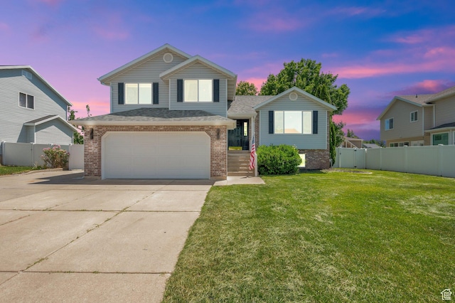 524 E 1200 S, Kaysville, UT 84037 - tri-level home featuring brick siding, concrete driveway, and an attached garage