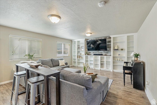 204 E 460 N, Vineyard, UT 84059 - living room with wood finished floors, baseboards, and a textured ceiling