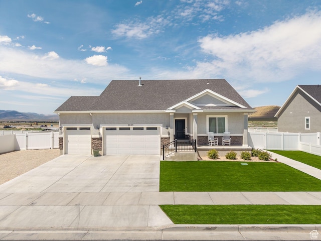 2025 E Granite Ln, Eagle Mountain, UT 84005 - craftsman-style home featuring an attached garage, a porch, stucco siding, and stone siding