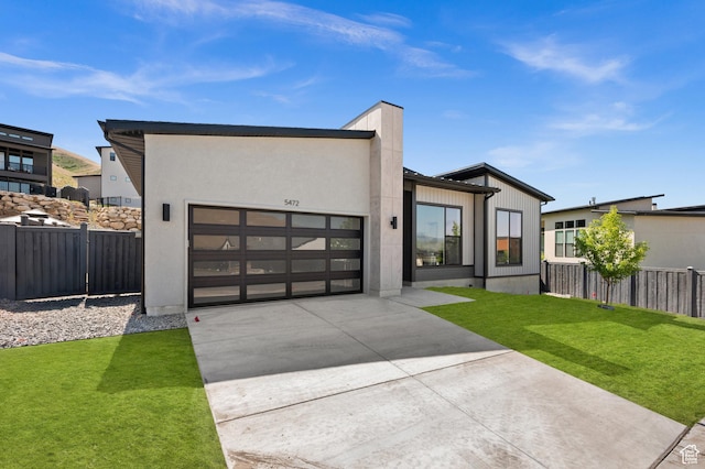 5472 N Valley View Rd W, Lehi, UT 84043 - contemporary house featuring concrete driveway and a garage