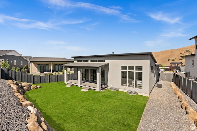 5472 N Valley View Rd W, Lehi, UT 84043 - rear view of house with stucco siding and a mountain view