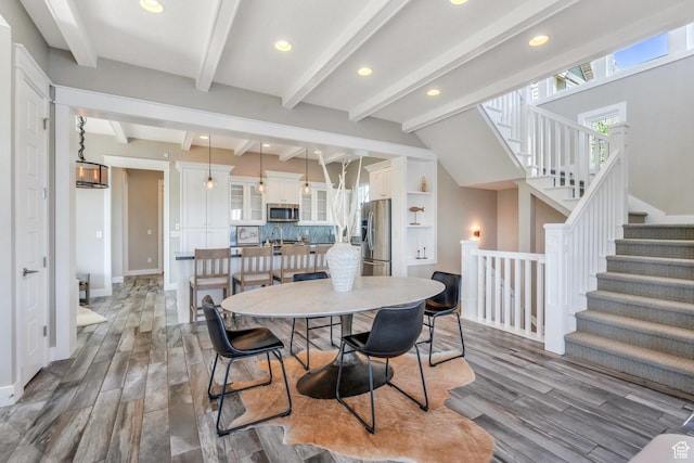 10764 S Felicity Ct, South Jordan, UT 84009 - dining area with wood finished floors, baseboards, recessed lighting, beam ceiling, and stairs