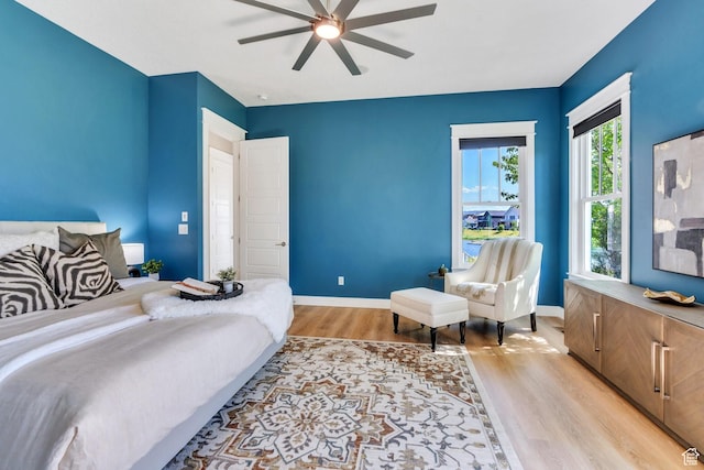 10764 S Felicity Ct, South Jordan, UT 84009 - bedroom featuring light wood-type flooring, baseboards, and a ceiling fan