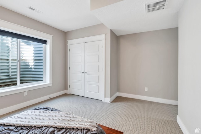 10764 S Felicity Ct, South Jordan, UT 84009 - bedroom featuring a closet, baseboards, and carpet
