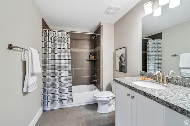 10764 S Felicity Ct, South Jordan, UT 84009 - full bathroom with vanity, toilet, shower / bath combo with shower curtain, baseboards, and a textured ceiling