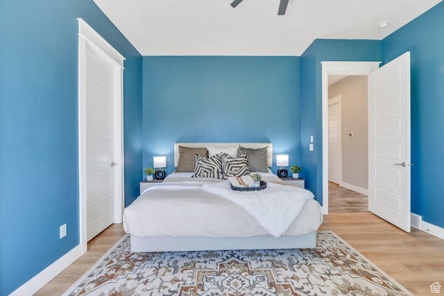 10764 S Felicity Ct, South Jordan, UT 84009 - bedroom featuring baseboards, wood finished floors, and a ceiling fan