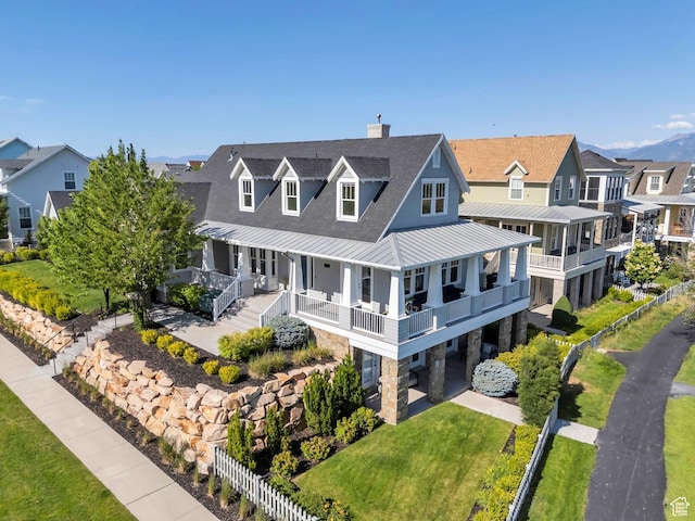 10764 S Felicity Ct, South Jordan, UT 84009 - view of front of home featuring a standing seam roof, metal roof, a residential view, a chimney, and roof with shingles