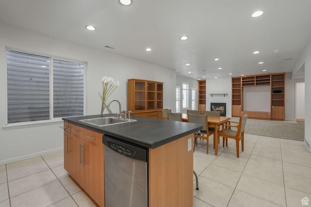 4554 W Birdie Way S, Jordan, UT 84009 - kitchen with dishwasher, a sink, dark countertops, light tile patterned floors, and recessed lighting
