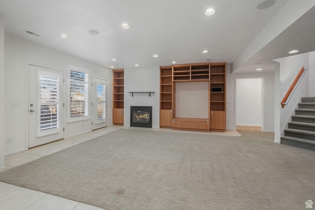 4554 W Birdie Way S, Jordan, UT 84009 - unfurnished living room featuring recessed lighting, stairway, a fireplace with flush hearth, baseboards, and built in features