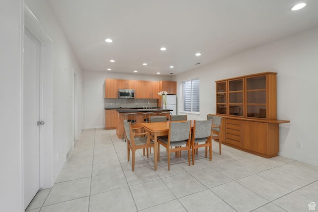 4554 W Birdie Way S, Jordan, UT 84009 - dining room with recessed lighting, light tile patterned floors, and baseboards