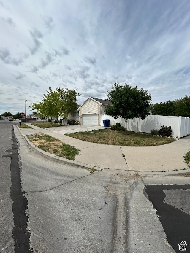 3086 S Fernbush Dr, Magna, UT 84044 - view of asphalt road featuring sidewalks and curbs