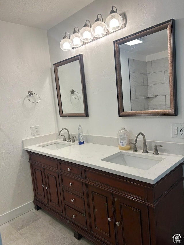 3086 S Fernbush Dr, Magna, UT 84044 - bathroom featuring double vanity and baseboards