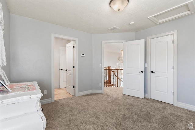 521 W Western Dr S, Kaysville, UT 84037 - unfurnished bedroom featuring carpet floors, baseboards, a textured ceiling, and ensuite bathroom