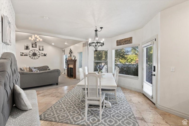521 W Western Dr S, Kaysville, UT 84037 - dining area with a chandelier, baseboards, lofted ceiling, and a fireplace
