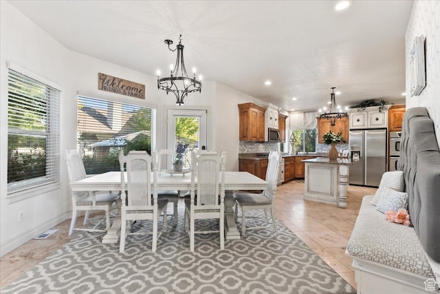 521 W Western Dr S, Kaysville, UT 84037 - dining space with a chandelier, plenty of natural light, recessed lighting, and light tile patterned flooring