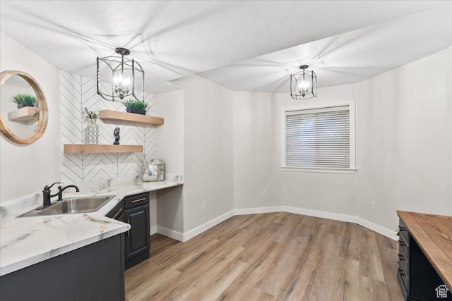 521 W Western Dr S, Kaysville, UT 84037 - kitchen featuring a sink, open shelves, light wood-type flooring, and a chandelier