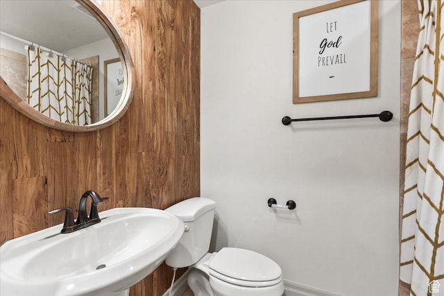 521 W Western Dr S, Kaysville, UT 84037 - bathroom with a sink, toilet, baseboards, and wooden walls