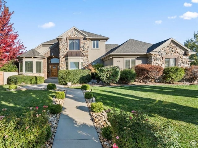 521 W Western Dr S, Kaysville, UT 84037 - view of front facade with stone siding, a front yard, and stucco siding