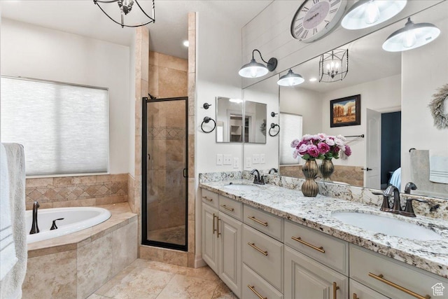 521 W Western Dr S, Kaysville, UT 84037 - bathroom featuring a bath, a chandelier, a stall shower, and double vanity