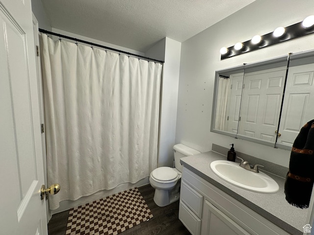 750 S 400 E Unit 38, Brigham City, UT 84302 - full bathroom featuring toilet, vanity, a textured ceiling, and wood finished floors
