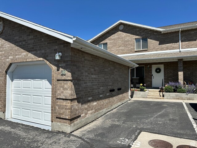 750 S 400 E Unit 38, Brigham City, UT 84302 - view of property exterior with a garage and brick siding