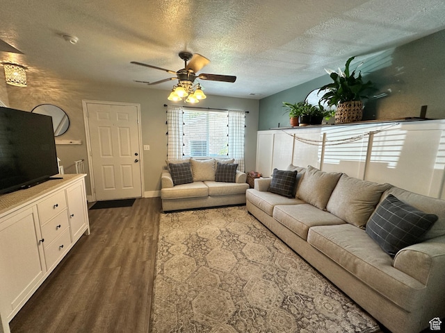 750 S 400 E Unit 38, Brigham City, UT 84302 - living area featuring dark wood-type flooring, ceiling fan, a textured ceiling, and baseboards