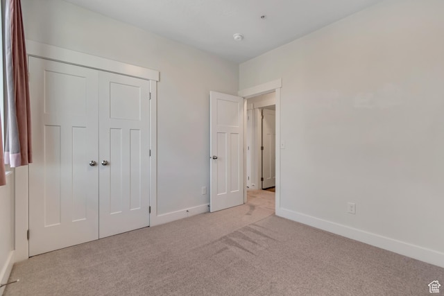 3919 W 1530 N Unit 202, Lehi, UT 84043 - unfurnished bedroom featuring light carpet, baseboards, and a closet