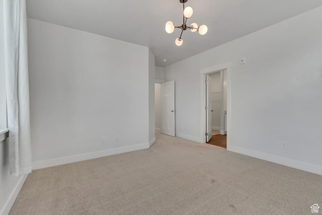 3919 W 1530 N Unit 202, Lehi, UT 84043 - carpeted empty room featuring a chandelier and baseboards
