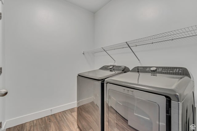 3919 W 1530 N Unit 202, Lehi, UT 84043 - laundry room with washing machine and dryer, baseboards, and wood finished floors