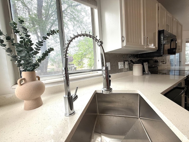 206 E Handcart Way, Sandy, UT 84070 - kitchen view of black appliances and decorative backsplash