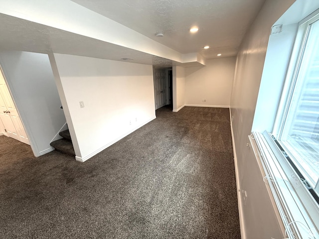 206 E Handcart Way, Sandy, UT 84070 - basement with dark carpet, baseboards, recessed lighting, and stairs