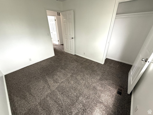 206 E Handcart Way, Sandy, UT 84070 - unfurnished bedroom featuring baseboards, a closet, and dark colored carpet