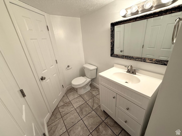 206 E Handcart Way, Sandy, UT 84070 - half bathroom with vanity, a textured ceiling, toilet, baseboards, and tile patterned flooring