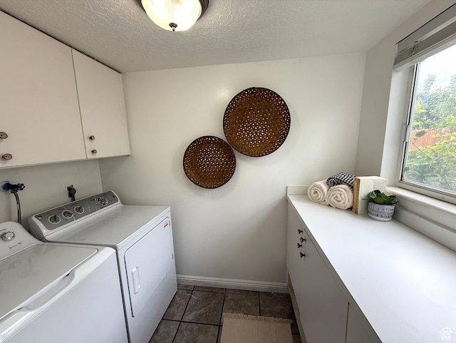 206 E Handcart Way, Sandy, UT 84070 - laundry area with cabinet space, independent washer and dryer, baseboards, plenty of natural light, and a textured ceiling