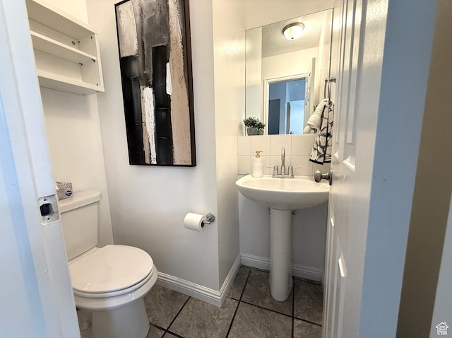206 E Handcart Way, Sandy, UT 84070 - bathroom with tile patterned floors, toilet, baseboards, and a sink