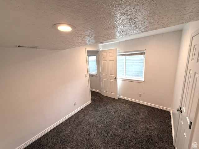 206 E Handcart Way, Sandy, UT 84070 - empty room with baseboards, a textured ceiling, dark carpet, and recessed lighting