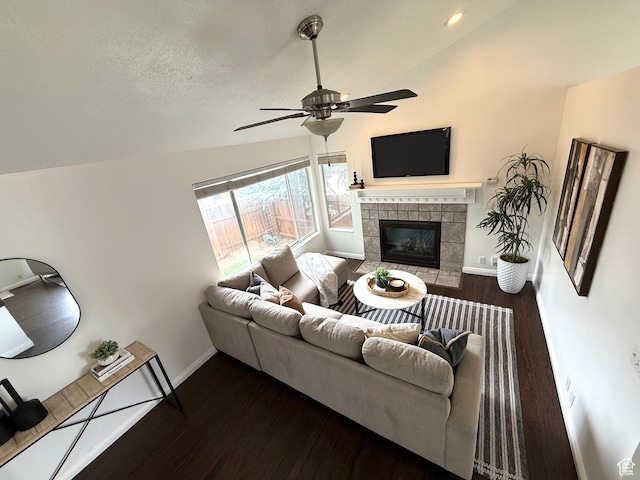 206 E Handcart Way, Sandy, UT 84070 - living area featuring vaulted ceiling, ceiling fan, wood finished floors, a tiled fireplace, and baseboards