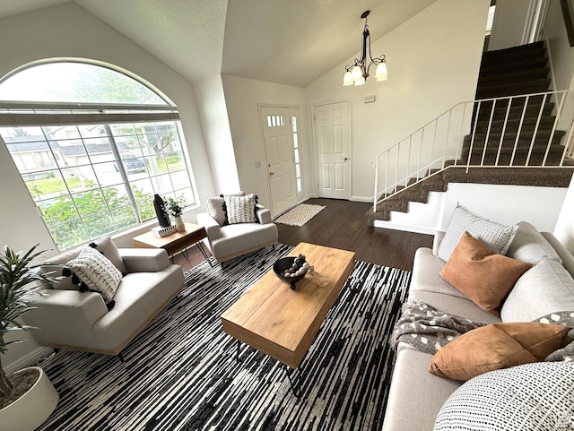 206 E Handcart Way, Sandy, UT 84070 - living area featuring vaulted ceiling, stairway, dark wood finished floors, a chandelier, and baseboards